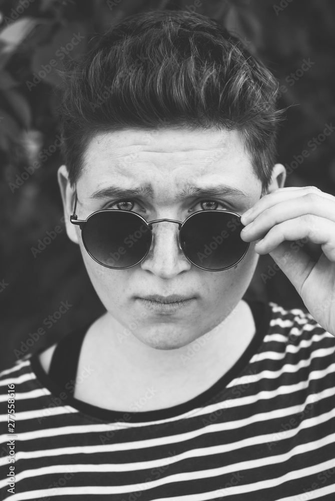 Girl in sunglasses with short hair, gender equality portrait, Girl in sunglasses with short hair, gender equality portrait,