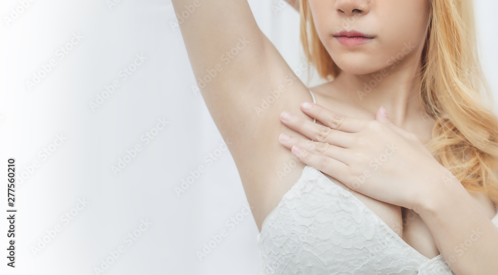 Beautiful woman showing her underarm with beautiful silky skin after doing hair removal Beautiful woman showing her underarm with beautiful silky skin after doing hair removal