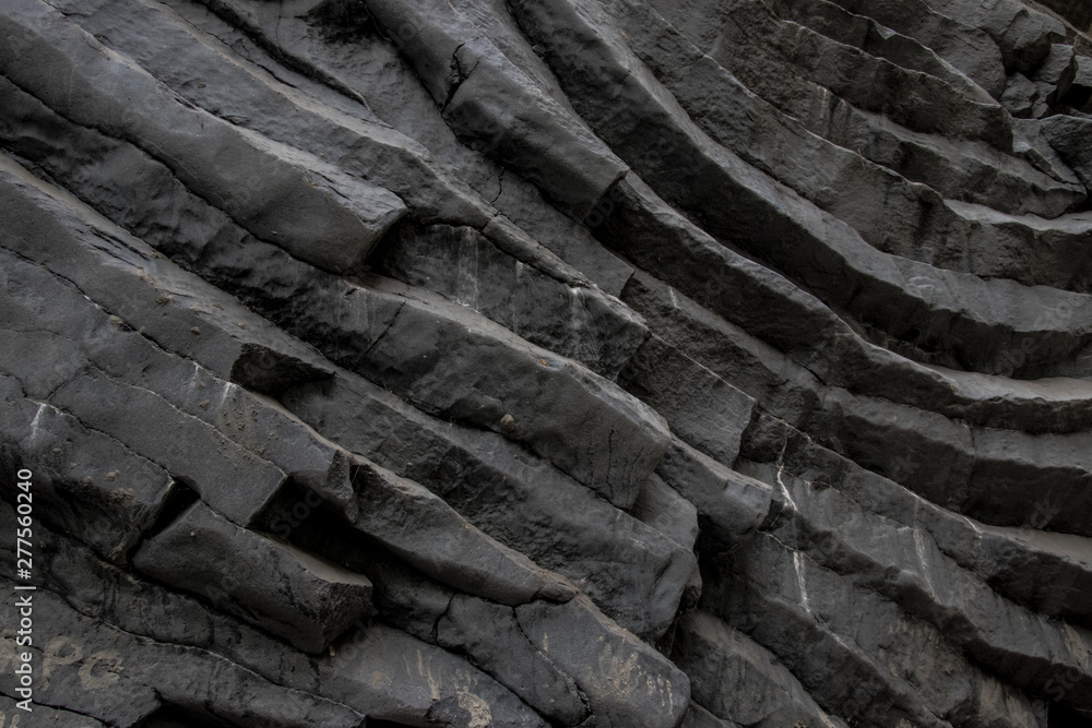Part of the dark grey rock in Italy. Colors and textures.