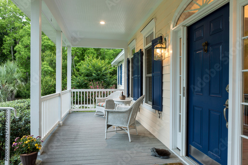 Beautiful front entrance of Southern home with covered porch. photo