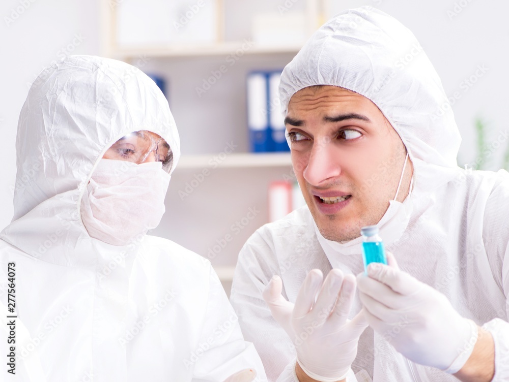 Two chemists working in the lab Two chemists working in the lab