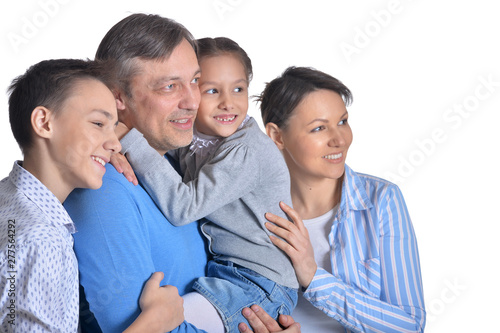 Portrait of happy smiling family of four posing
