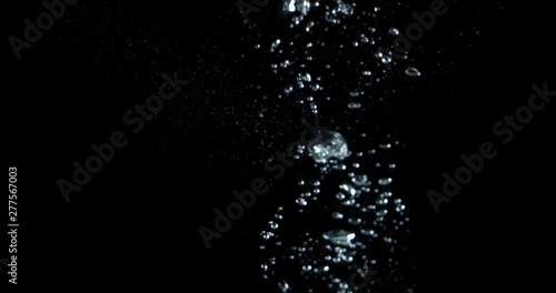 Blurry images of drinking water liquid bubbles or carbonate drink or oil shape or soda splashing and floating drop in black background for represent sparkling refreshment and refreshing