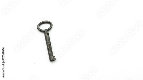 Small antique key on white background © katkami
