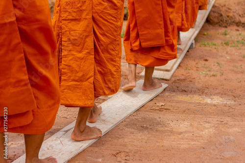 There was a merit making in the morning. People would scoop food into the alms of many monks.