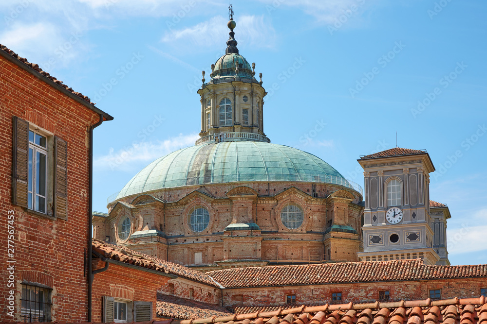 Sanctuary of Vicoforte dome and bricks buildings in a sunny summer day in Piedmont, Italy