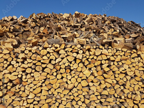 woods pile cut for fireplace stove many background