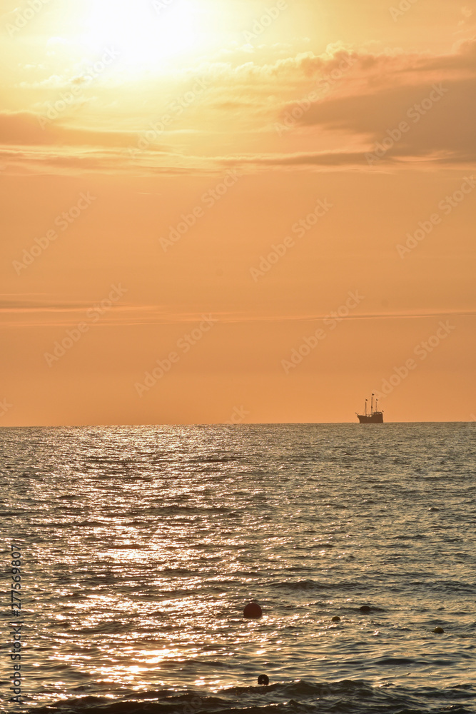 Golden Sunset at the Beach with Ship
