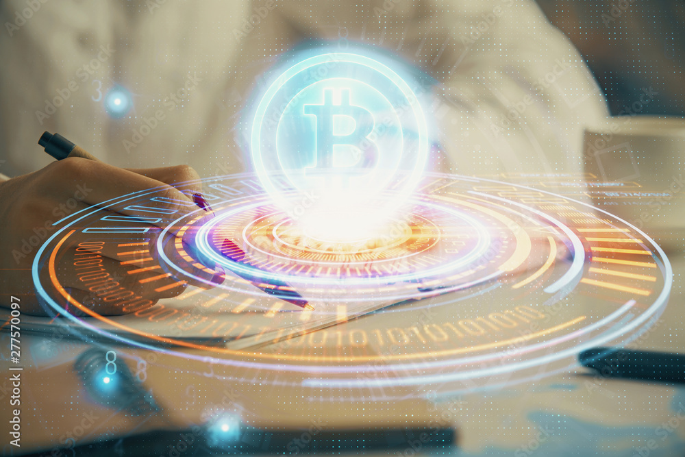 Obraz premium Cryptocurrency hologram over woman's hands writing background. Concept of blockchain. Double exposure