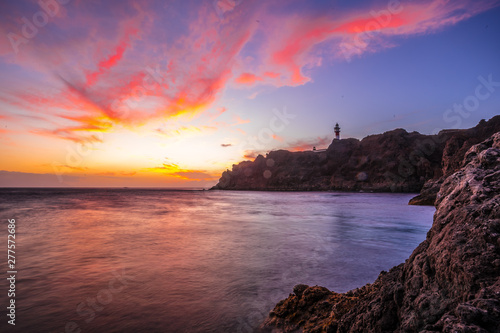 The lighthouse at a sunset of Punta de Teno seen from afar, Tenerife (Canary Islands)
