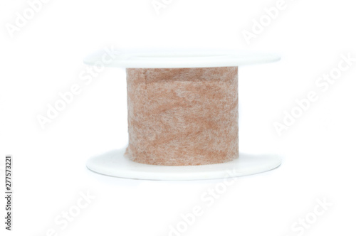 adhesive tape bandage for bruises, in beige color, isolated on white background - medicine health concept photo