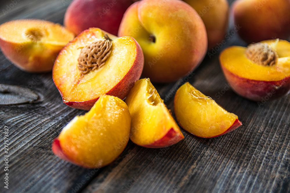 Fresh organic peaches on old wooden table Fresh organic peaches on old wooden table