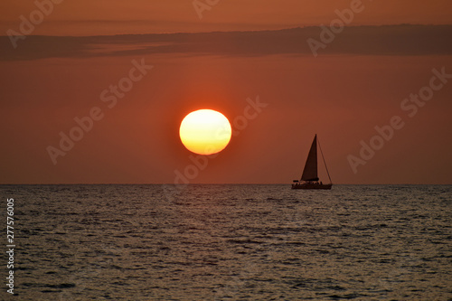 Red Sunset at the Beach with Boat