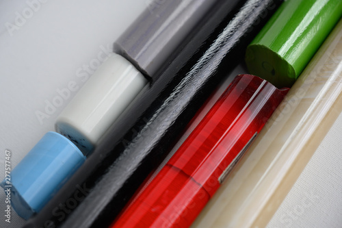 Assorted bar stock of translucent and opaque supplies for glass blowing
