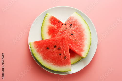 Watermelon slices in plate isolated onpink background. Summer foods. Isolated. photo