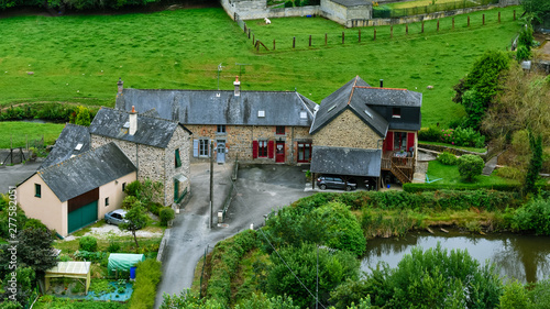 French Brittany typical countryside houses. Stone builts and slate roofs, in a green environment. photo