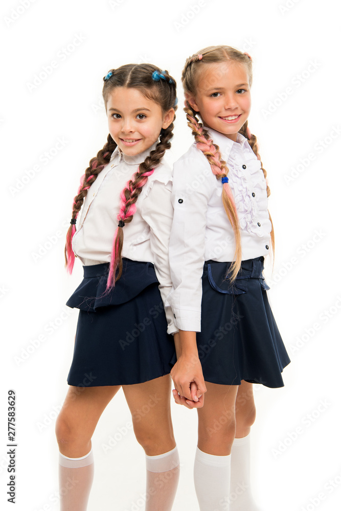 Appropriate hairstyle. Girls long braids. Fashion trend. It is awesome dye  hair fun colors. Keep hair braided for tidy look. Pupils with long braided  hair. Hairdresser salon. Hairstyles school style Stock Photo |