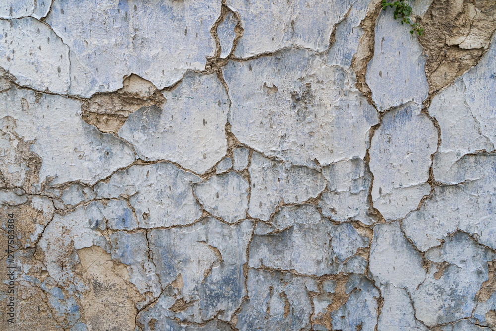 Old cracked parget (plaster) on a painted blue medieval wall of a house in Lefkara heritage village on Cyprus Old cracked parget (plaster) on a painted blue medieval wall of a house in Lefkara heritage village on Cyprus