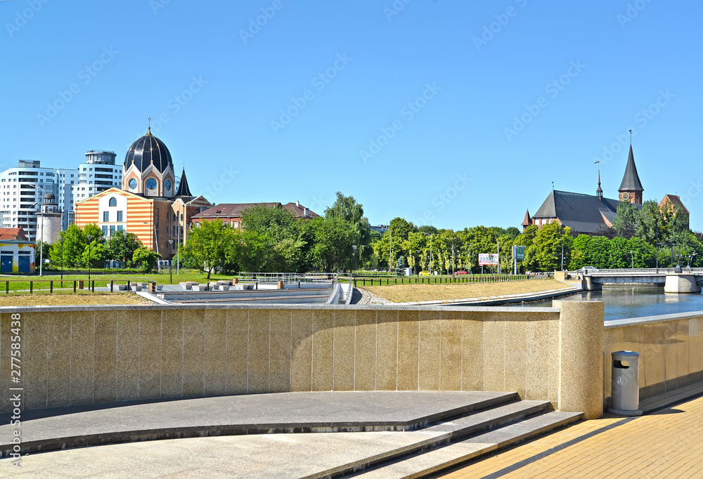 KALININGRAD, RUSSIA. A view of General Karbyshev Embankment with the Cathedral and the New Liberal synagogue
