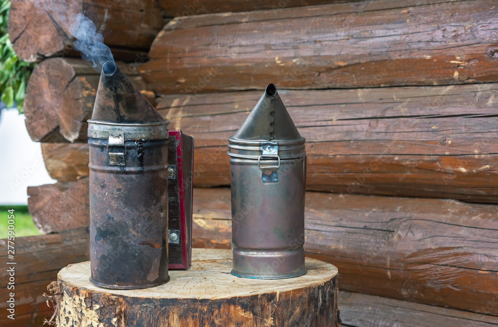 Bee smoker is used in beekeeping to suppression bees when inspecting beehive. Equipment for the beekeeper. Bee smoker is used in beekeeping to suppression bees when inspecting beehive. Equipment for the beekeeper.