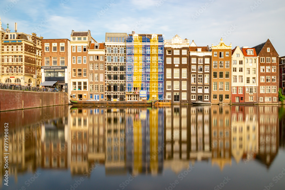 Amsterdam historic facades reflecting in the water