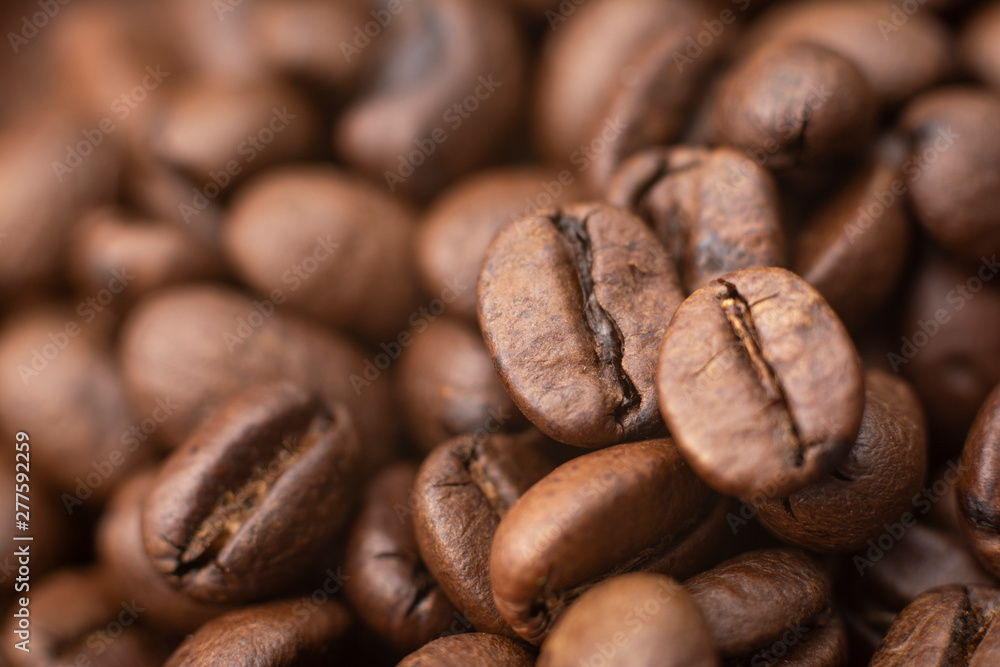Coffee beans. Coffee background. A coffee seed is a seed of the coffee plant, and is the source for coffee. Coffee beans. Coffee background. A coffee seed is a seed of the coffee plant, and is the source for coffee.