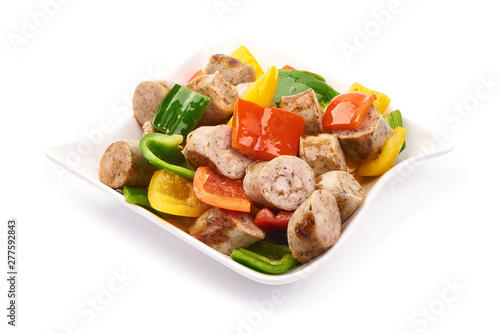 Fried Bavarian sausages with bell peppers, close-up, isolated on white background