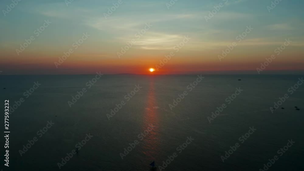 Beauty of colorful sky during the sunset, aerial view Boracay, Philippines. Beautiful sunset background from the colorful beams on the sky. Sunset over ocean. Seascape, Summer and travel vacation Beauty of colorful sky during the sunset, aerial view Boracay, Philippines. Beautiful sunset background from the colorful beams on the sky. Sunset over ocean. Seascape, Summer and travel vacation