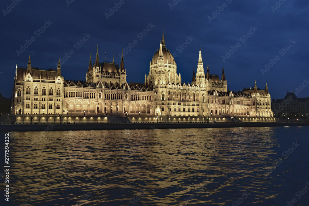Parliament building at night, reflecting on the Danube River, Budapest, Hungary