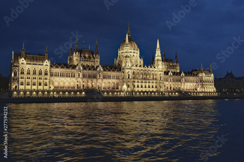 Parliament building at night, reflecting on the Danube River, Budapest, Hungary