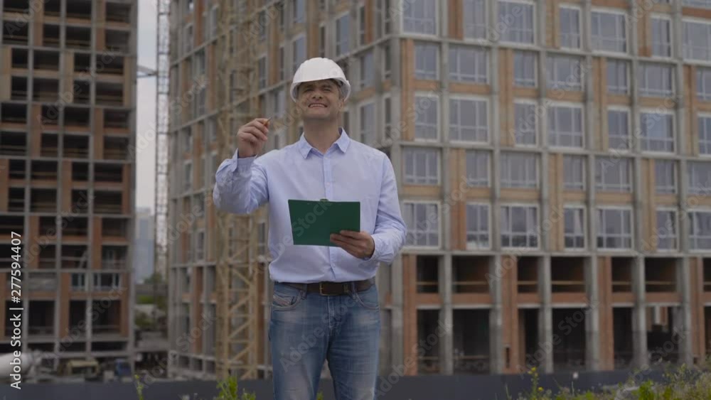 Engineer with white helmet and clipboard Engineer with white helmet and clipboard