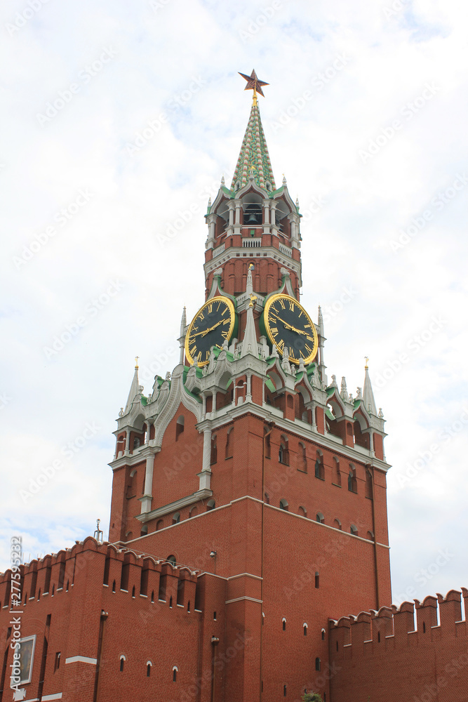 Kremlin tower symbol of Russia on Red Square in Moscow. Spasskaya tower of Moscow Kremlin isolated on dramatic cloudy sky background Kremlin tower symbol of Russia on Red Square in Moscow. Spasskaya tower of Moscow Kremlin isolated on dramatic cloudy sky background