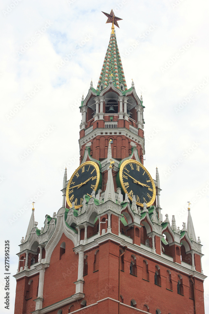 Kremlin tower symbol of Russia on Red Square in Moscow. Spasskaya tower of Moscow Kremlin isolated on dramatic cloudy sky background Kremlin tower symbol of Russia on Red Square in Moscow. Spasskaya tower of Moscow Kremlin isolated on dramatic cloudy sky background