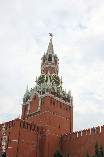 Kremlin tower and wall on Red square, main square of russian capital - Moscow city on cloudy day. Majestic Kremlin building on dramatic sky background 