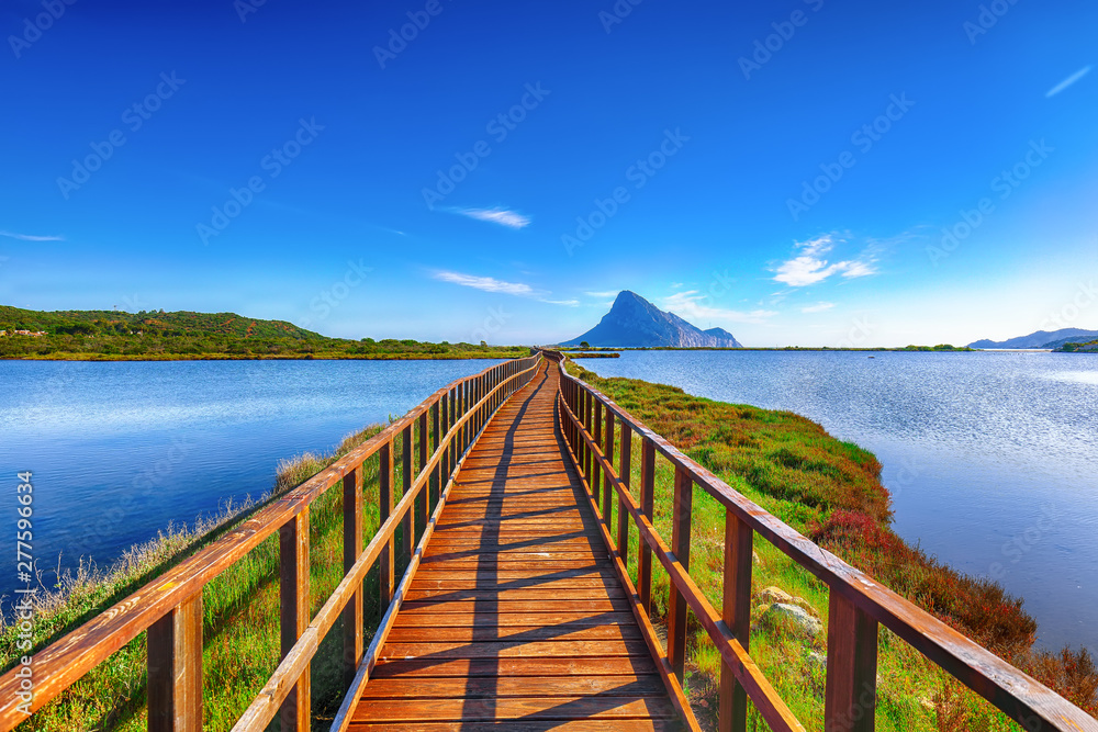 Sunrise from a pedestrian walkway to Porto Taverna beach. Sunrise from a pedestrian walkway to Porto Taverna beach.
