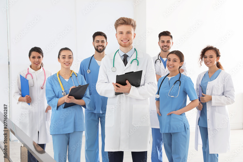 Team of medical workers in hospital. Unity concept Team of medical workers in hospital. Unity concept