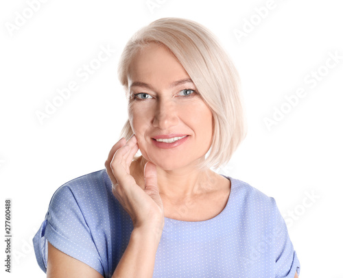 Portrait of charming mature woman with healthy beautiful face skin and natural makeup on white background