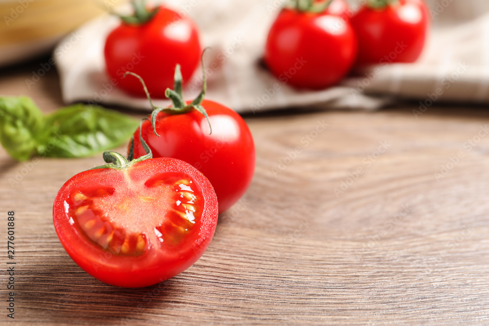 Fresh cherry tomatoes on wooden background. Space for text Fresh cherry tomatoes on wooden background. Space for text