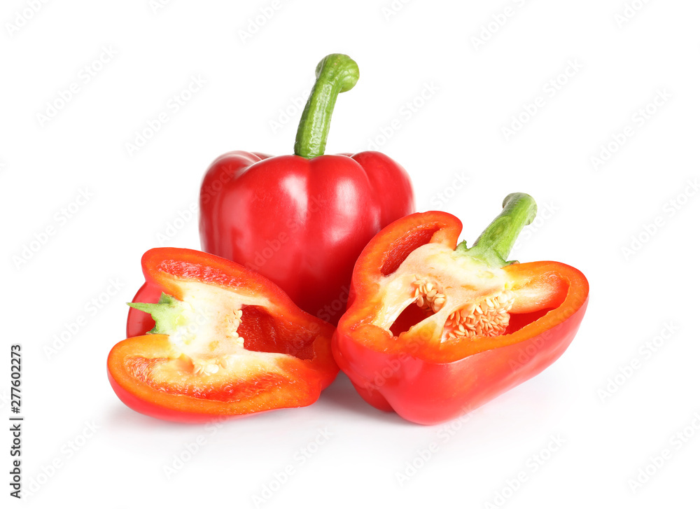 Cut and whole ripe red bell peppers on white background Cut and whole ripe red bell peppers on white background