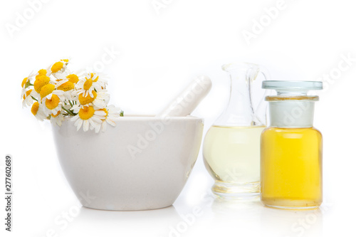 Chamomile, flowers and mortar, bottle.