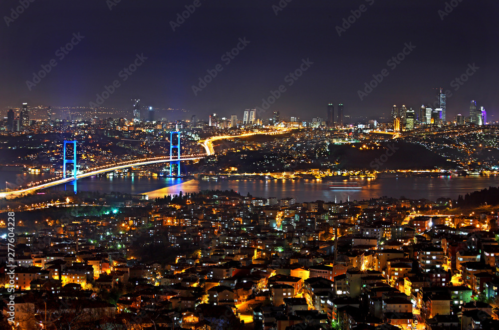 ISTANBUL, TURKEY. A night view of the first bridge of Bosphorus, the one not only connecting the two sides of Istanbul, but also, Europe and Asia.  Photo taken from Camlica hill.