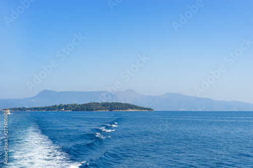 Vido Island near the Corfu town from the ship in summer day