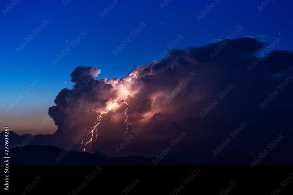 Thunderstorm cumulonimbus cloud and lightning strike