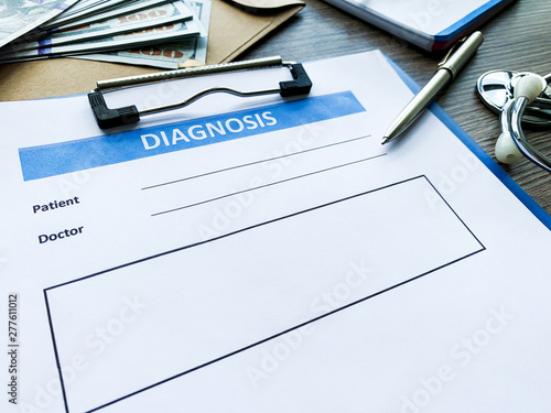 Diagnosis form with the patient's data on the doctors desk.