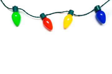 Colorful Christmas lights on a white background