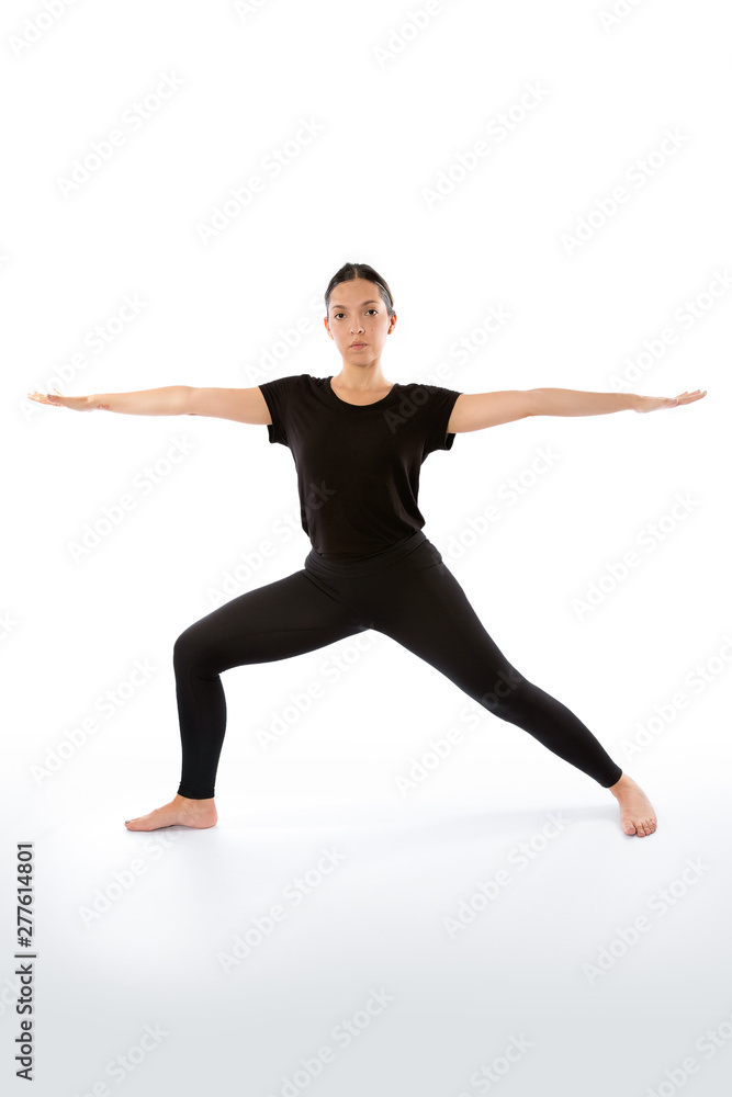 Virabhadrasana (warrior pose). Yoga poses woman isolated with white background. Yoga pose set. Mindfulness and Spiritually concept. Girl practicing Hatha Yoga asanas Virabhadrasana (warrior pose). Yoga poses woman isolated with white background. Yoga pose set. Mindfulness and Spiritually concept. Girl practicing Hatha Yoga asanas
