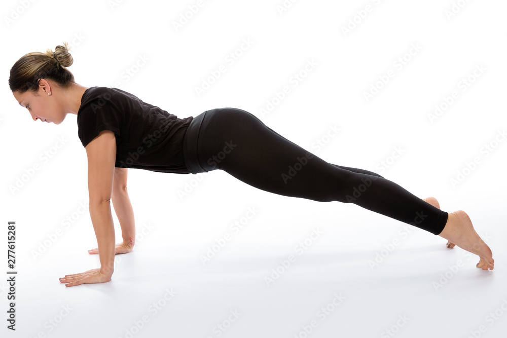 Phalakasana yoga pose (plank pose). Yoga poses woman isolated with white background. Yoga pose set. Mindfulness and Spiritually concept. Girl practicing Hatha Yoga asanas Phalakasana yoga pose (plank pose). Yoga poses woman isolated with white background. Yoga pose set. Mindfulness and Spiritually concept. Girl practicing Hatha Yoga asanas