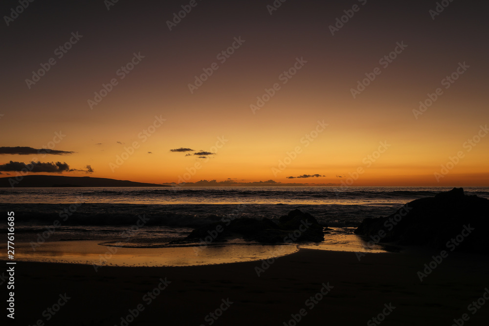 The sun sets on the south shore of Maui near Kiheh and Wilea