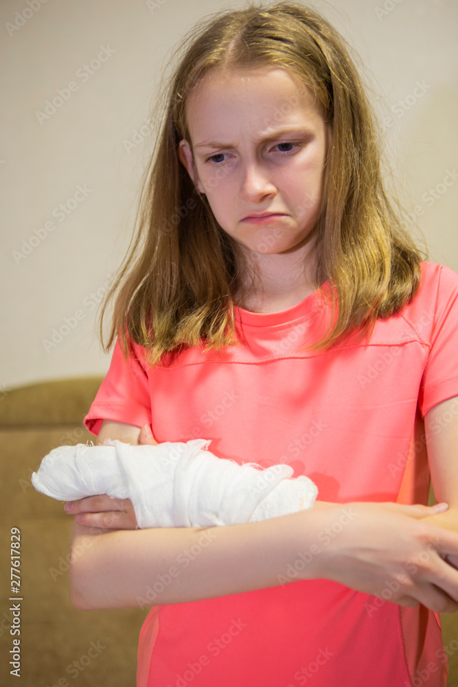 Portrait of Down Caucasian Girl With Injured Hand In Plaster. Portrait of Down Caucasian Girl With Injured Hand In Plaster.