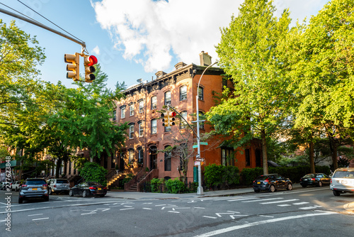 Clinton Hill, Brooklyn, United States - June 30, 2019: Historic brownstone building on beautiful summer evening in Clinton Hill, Brooklyn, New York.